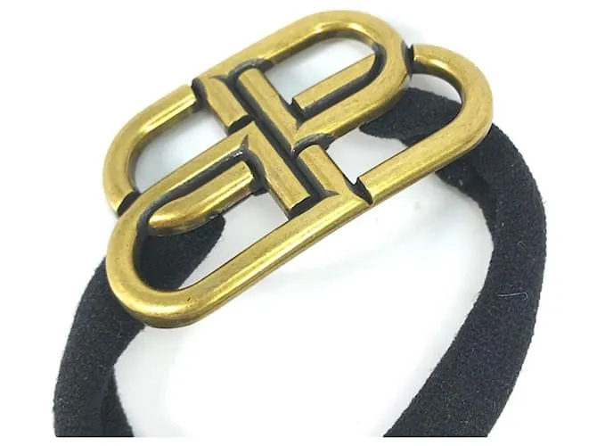 Balenciaga Cabello de Goma Dorado y Negro 