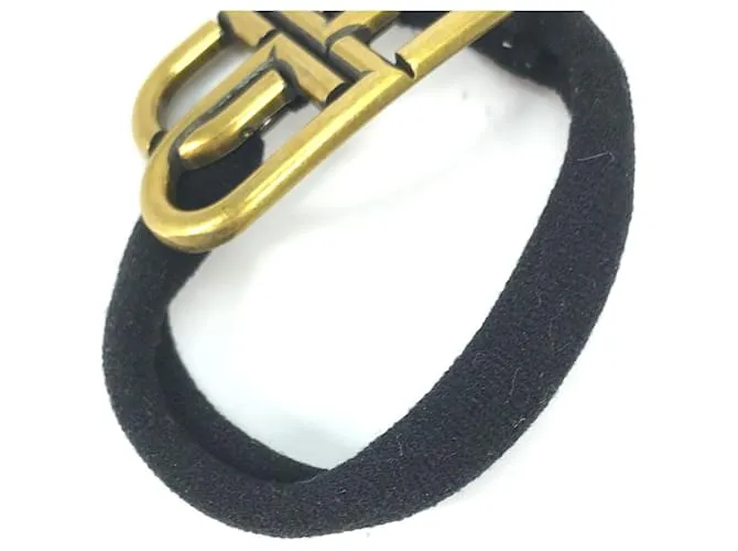 Balenciaga Cabello de Goma Dorado y Negro 