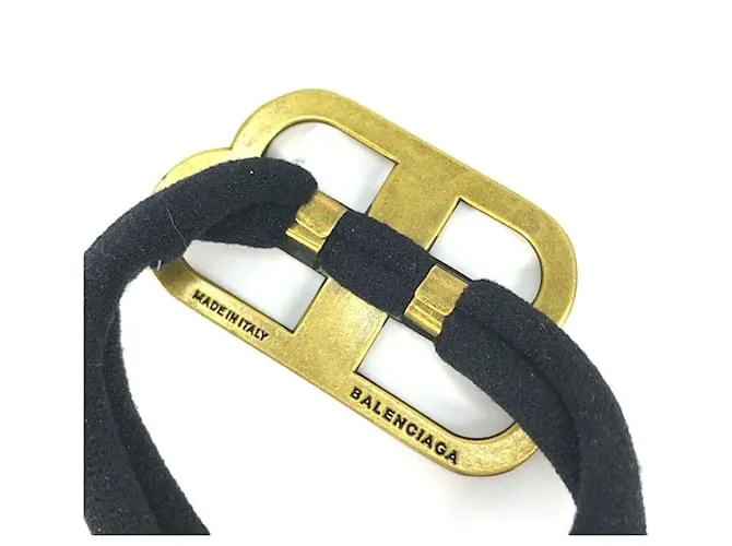 Balenciaga Cabello de Goma Dorado y Negro 